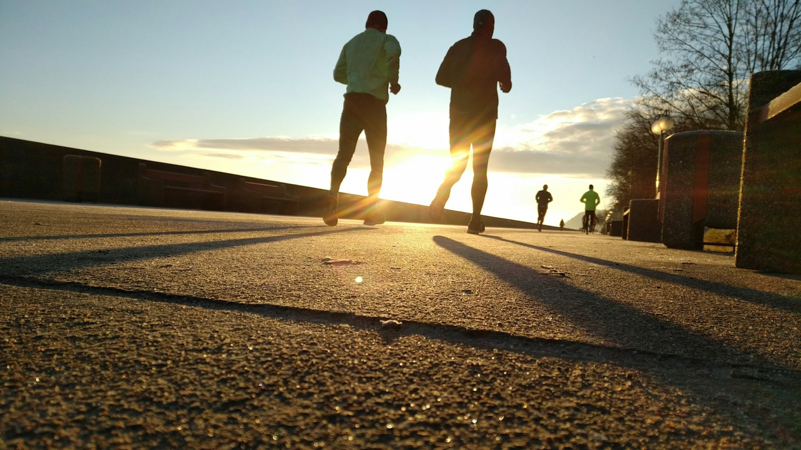Walvis Bay Road Runners members running together at sunrise along the coast road